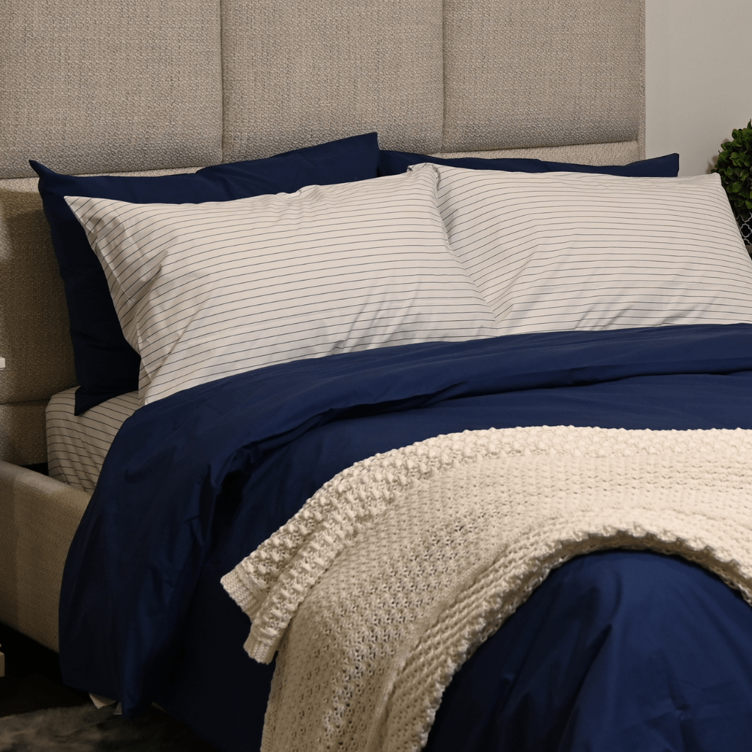 Bed with Navy Stripe pillowcases
