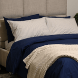 Bed with Navy Stripe pillowcases