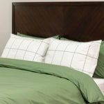organic percale leaf frame pillowcases on bed