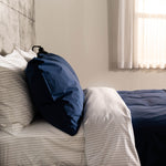 Organic Percale Navy Pillowcase on bed