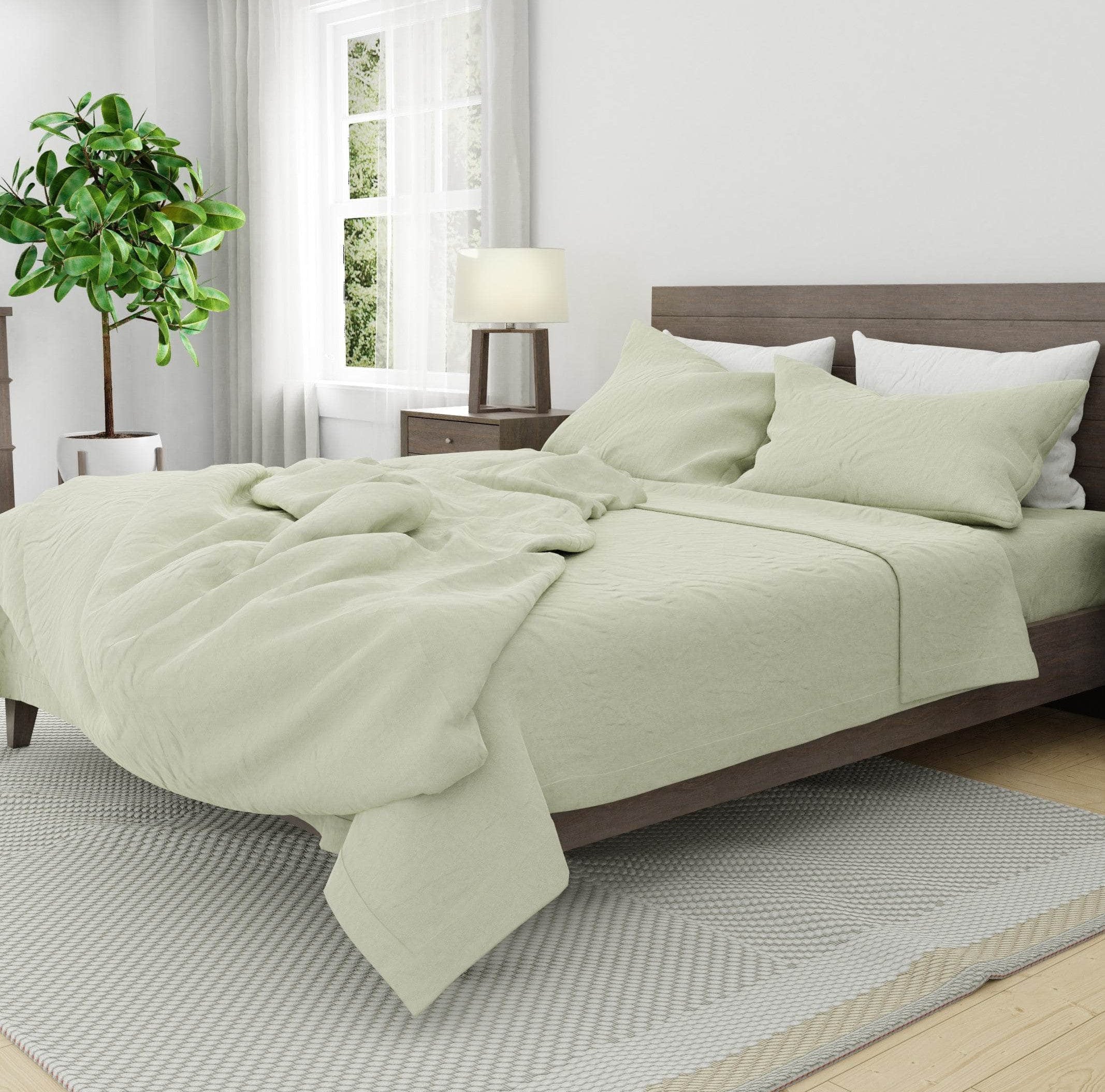 Bed with linen duvet cover in seafoam and white linen pillow cases