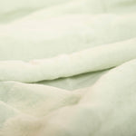 Close up of seafoam linen duvet cover