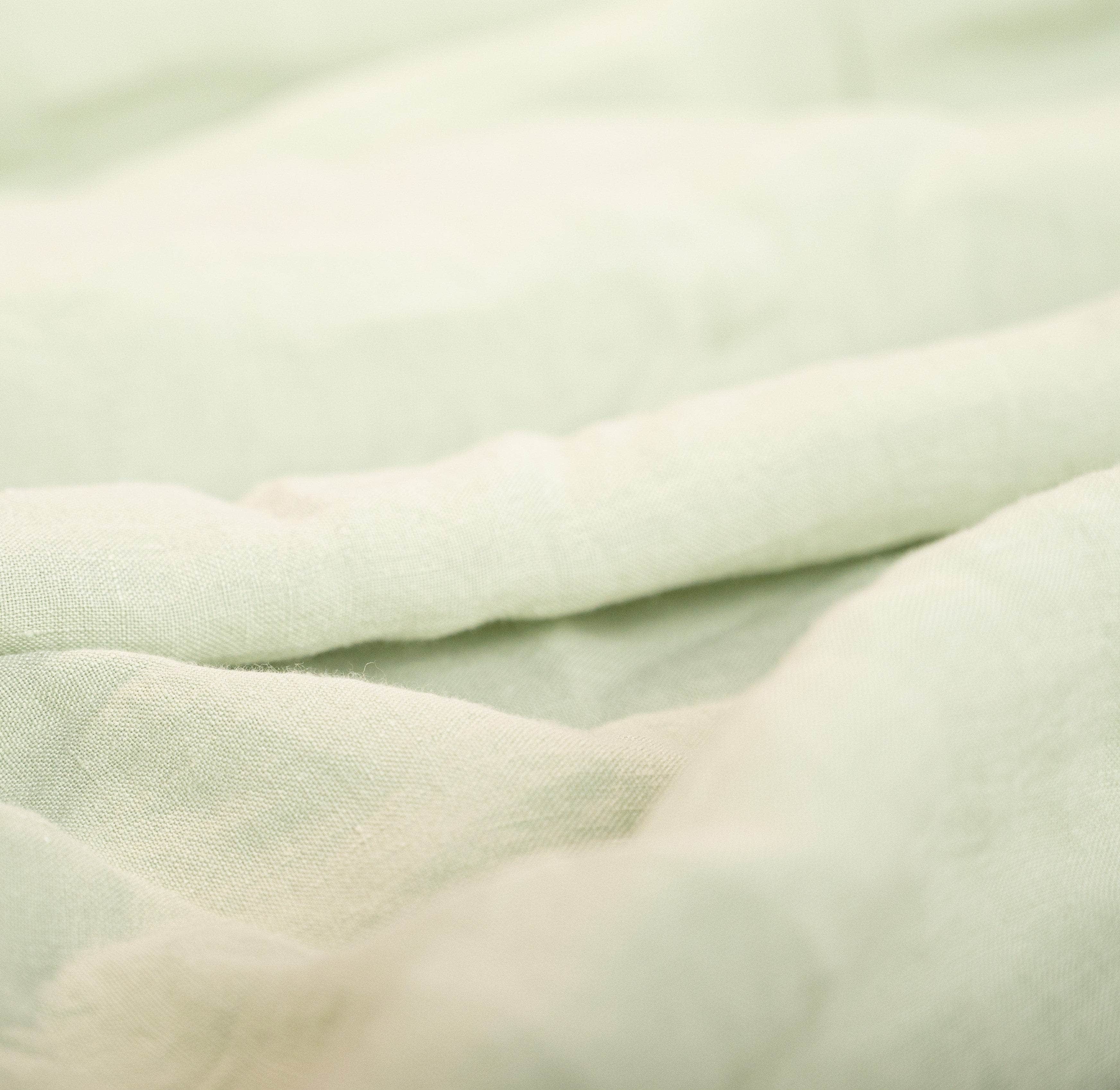 Close up of seafoam linen duvet cover