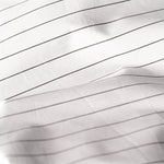 Close Up of Organic Percale Pillowcases in Charcoal Stripe
