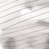 Close Up of Organic Percale Pillowcases in Charcoal Stripe