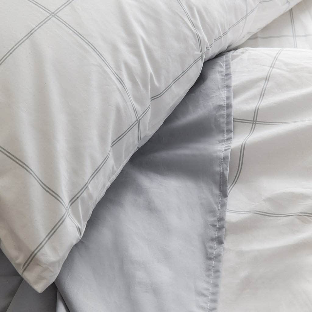 Bed featuring the Organic Percale Pillowcases in Light Grey Frame