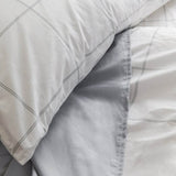 Bed featuring the Organic Percale Pillowcases in Light Grey Frame