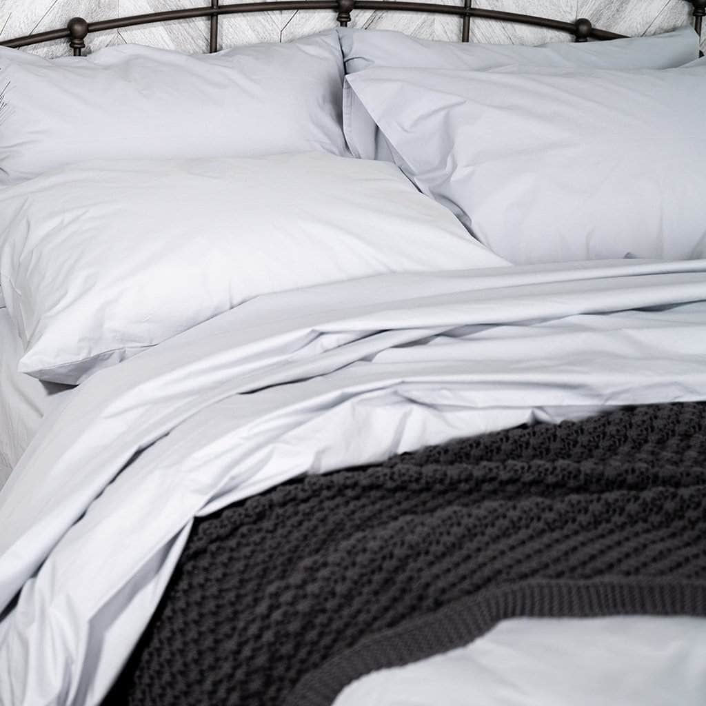 Bed featuring the Organic Percale Pillowcases in Light Grey