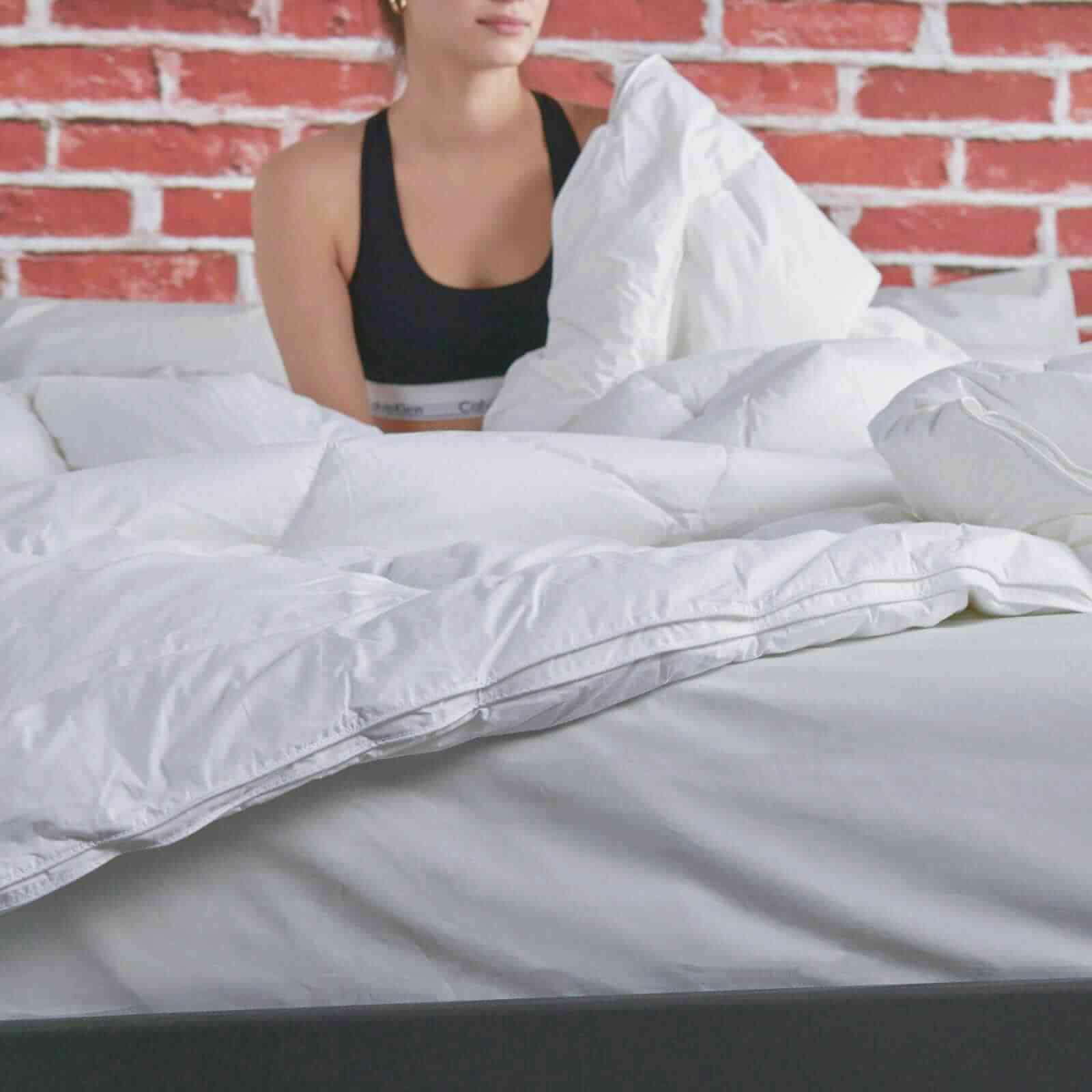 Woman in bed with Down Alternative Duvet Insert