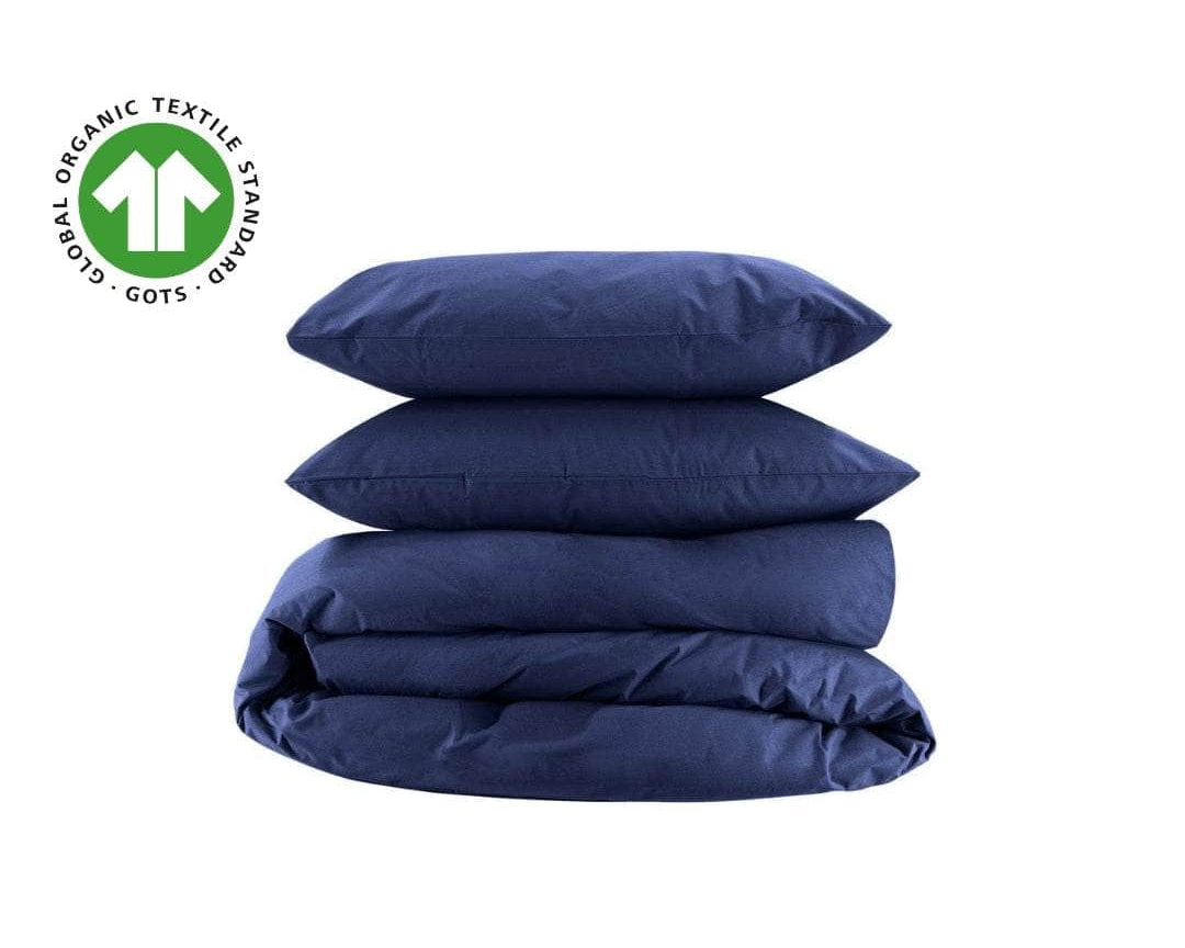 Navy organic percale duvet cover and pillowcases, folded