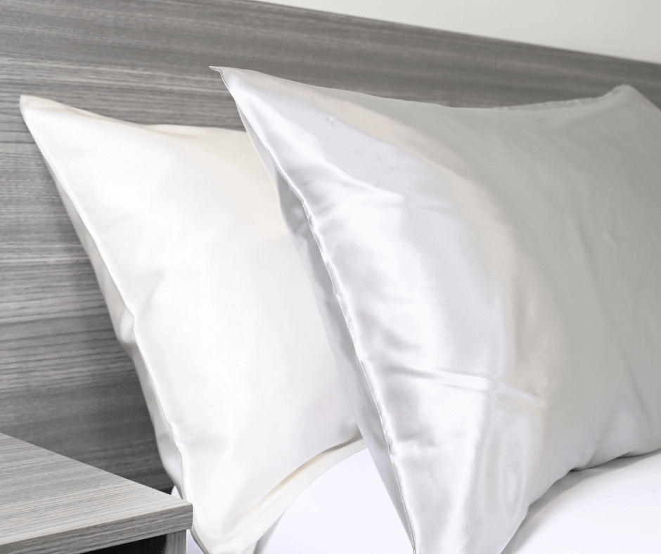 White and Silver Grey Silk pillows on a bed| Skylark+Owl Linen Co.