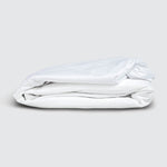 Image of a folded Cooling 5-Sided Mattress Protector on a white