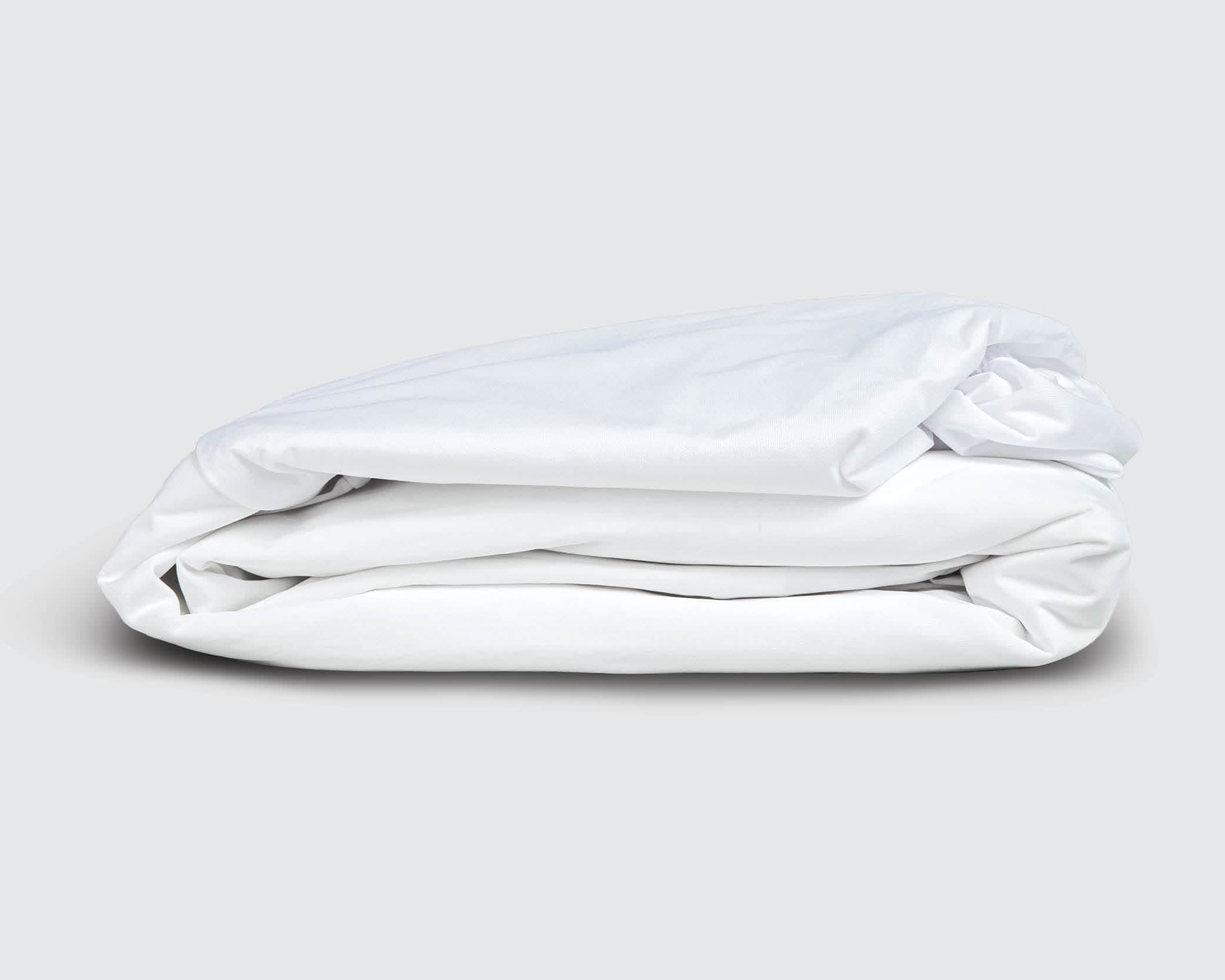 Image of a folded Cooling 5-Sided Mattress Protector on a white