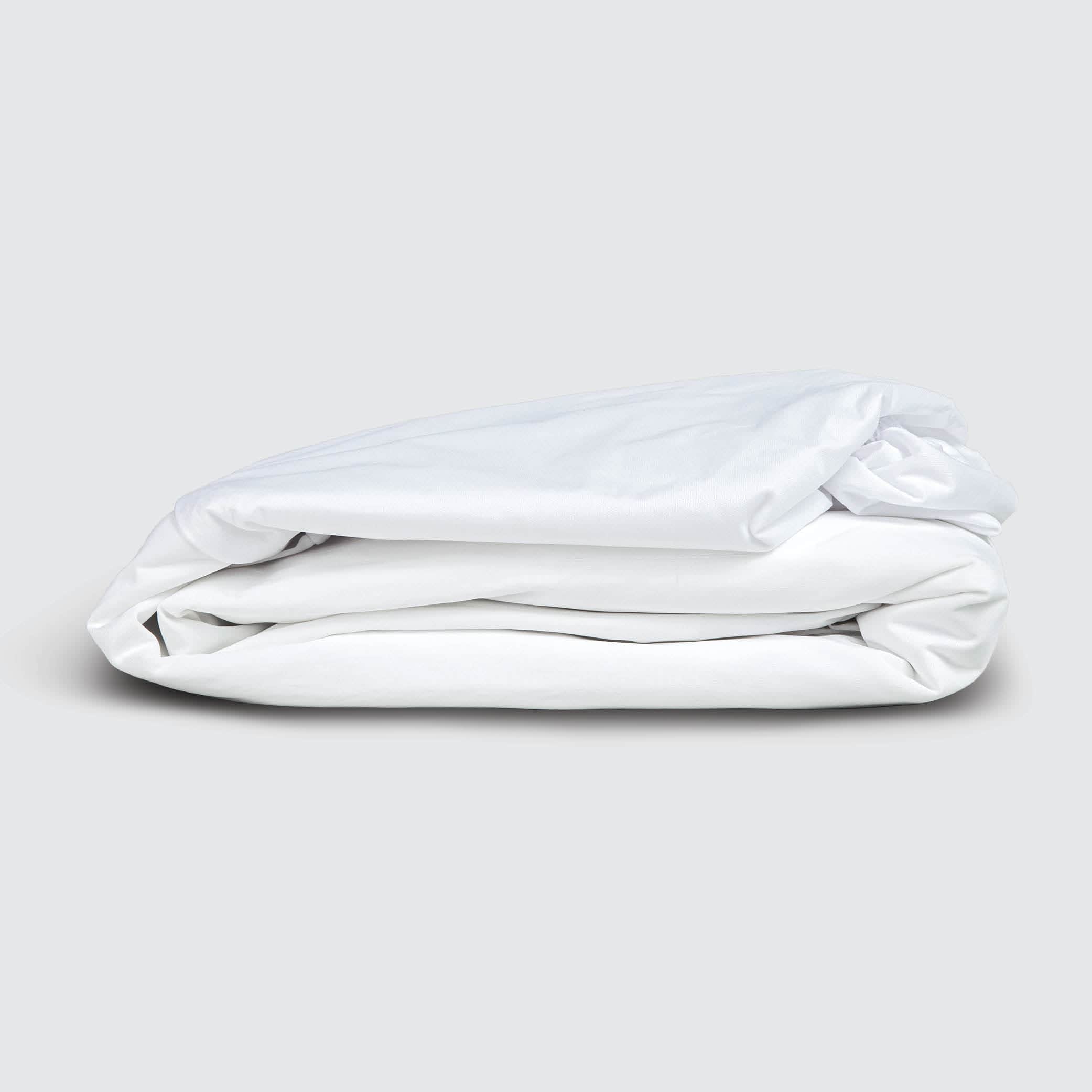 Image of a folded Cooling 5-Sided Mattress Protector on a white
