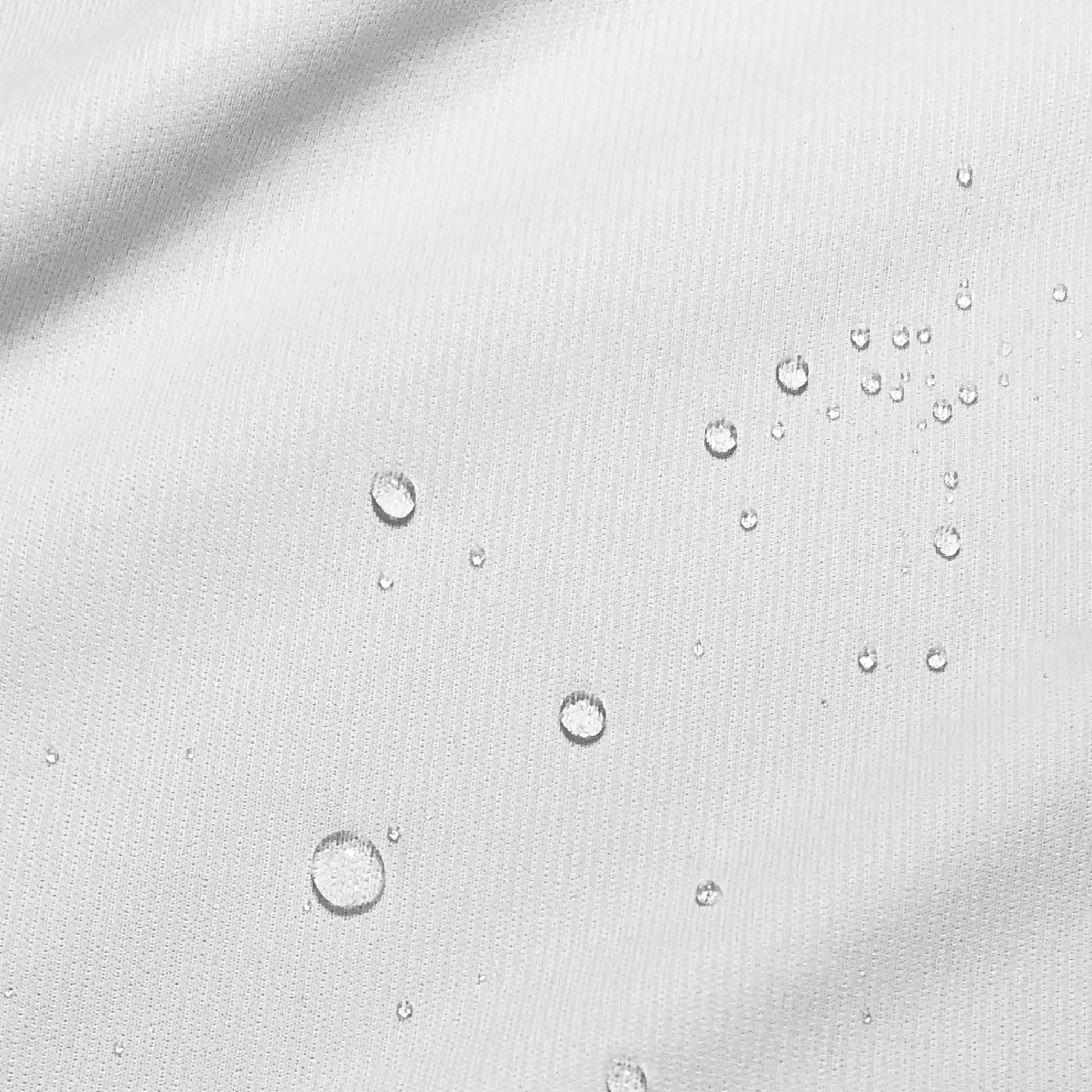 Close-up image of water droplets on a mattress protector