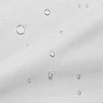 Close-up image of water droplets on a mattress protector