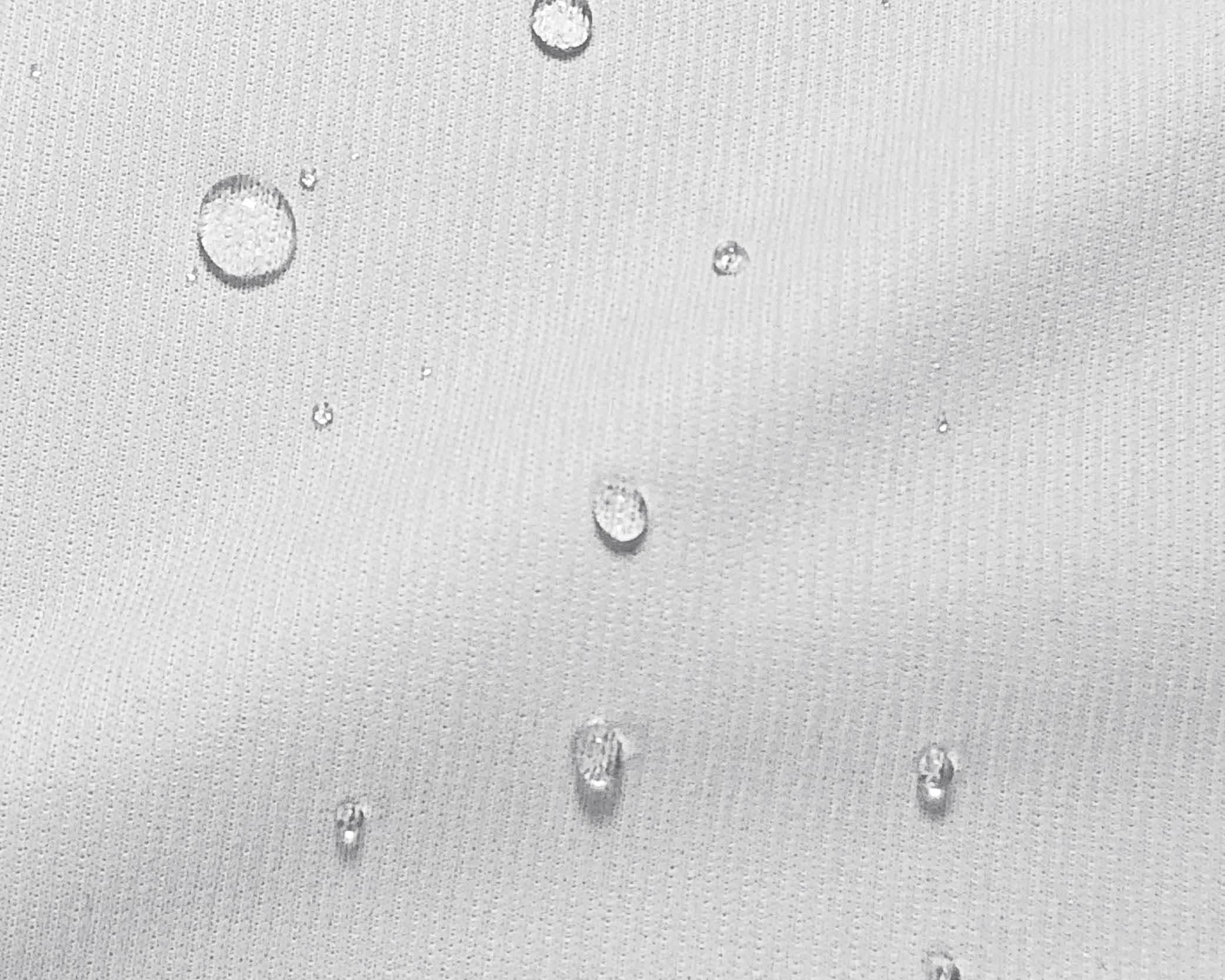 Close-up image of water droplets on a mattress protector