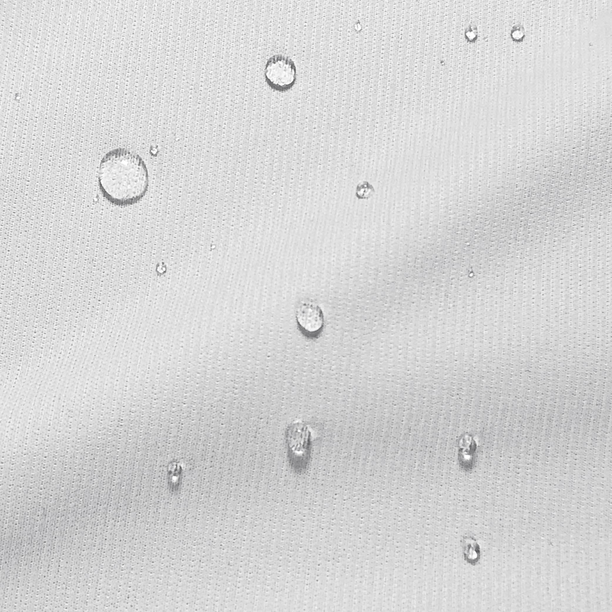 Close-up image of water droplets on a mattress protector