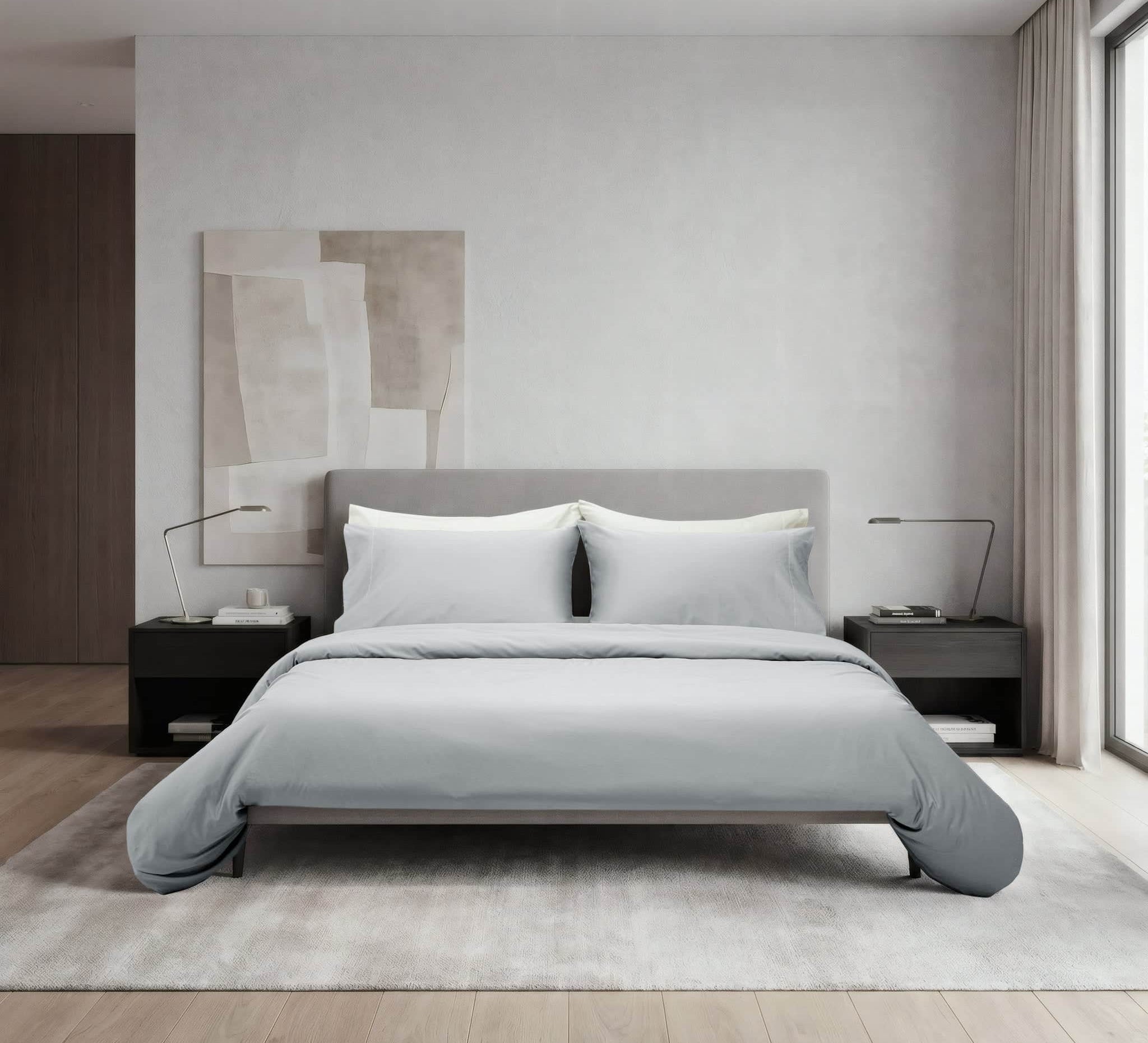 Modern bedroom with a gray bed and minimal decor
