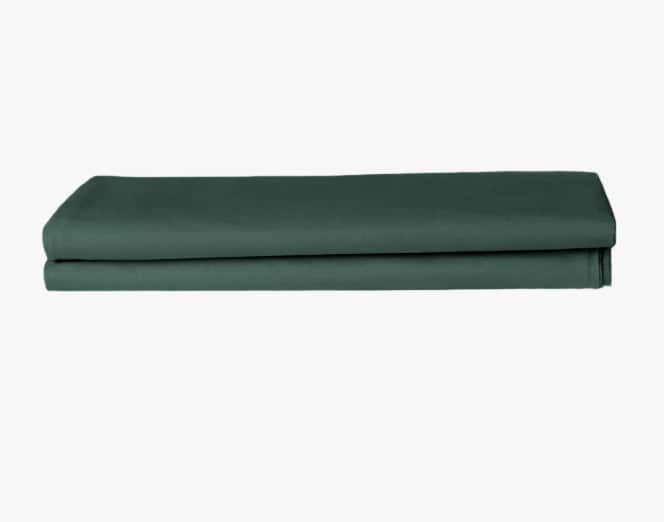 Folded green fabric on a white background