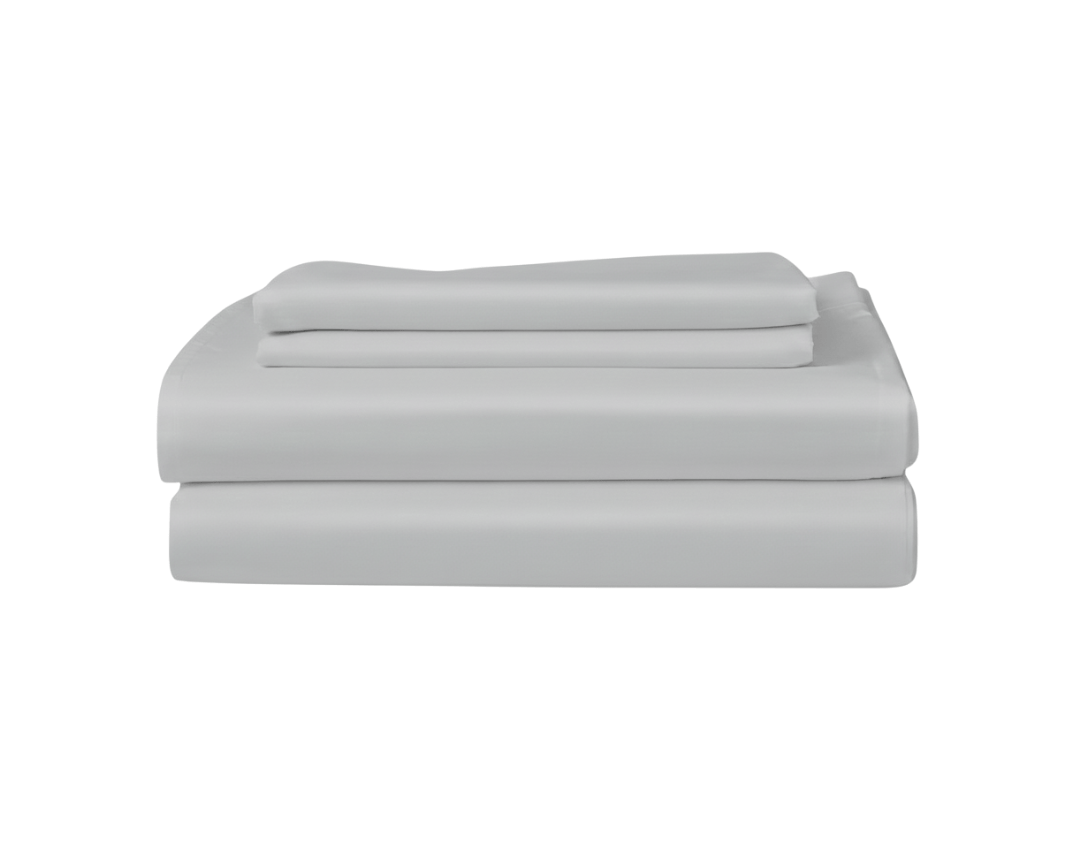 Stack of light gray folded sateen sheetson a white background