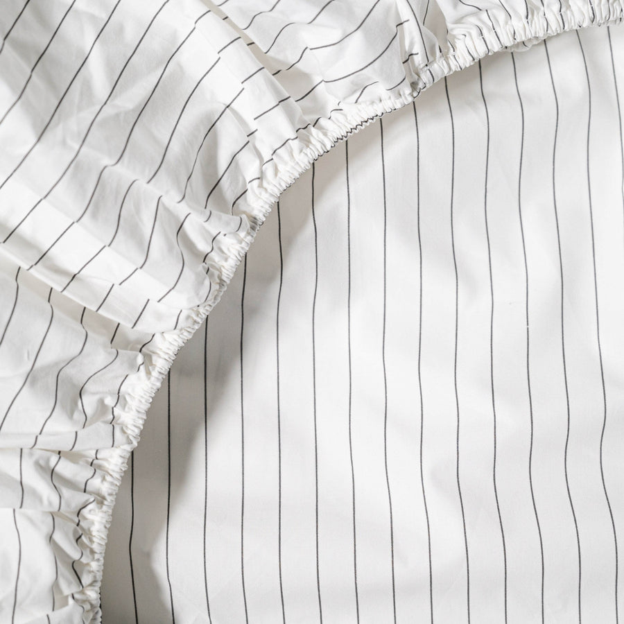 Close up of Essential Collection Percale Fitted Sheet in Charcoal Stripe