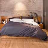 Bed with Essential Collection Percale Sheet Set in Charcoal Stripe styled with the Essential Collection Percale Duvet Cover and Pillowcases in Charcoal