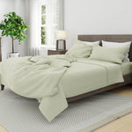 Bed with Linen Duvet Cover in Seafoam and Linen Pillowcases in White