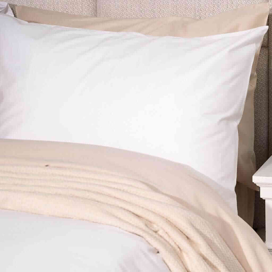Latte brushed cotton blanket on bed