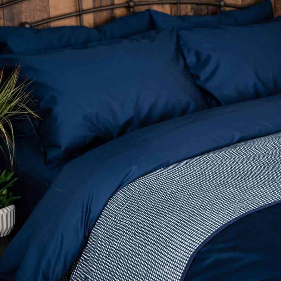 Sapphire Alpine brushed cotton blanket on navy bedding