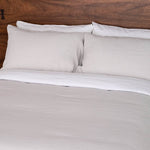 Bed with Linen Duvet Cover in Mushroom and with Linen Sheet Set in White