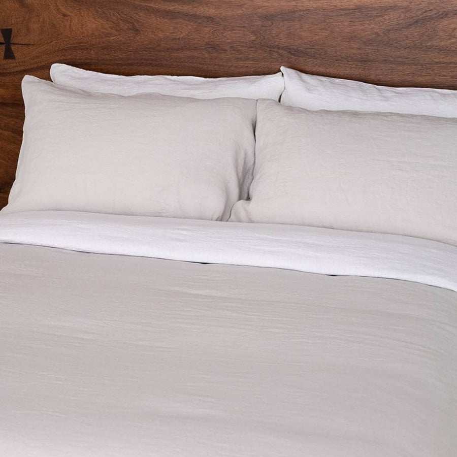 close up of bed  linen sheet set and duvet cover in white