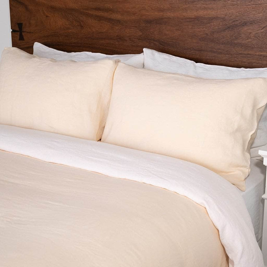 Close up of bed featuring Linen Duvet Cover in Pearl and Linen Sheet Set in White