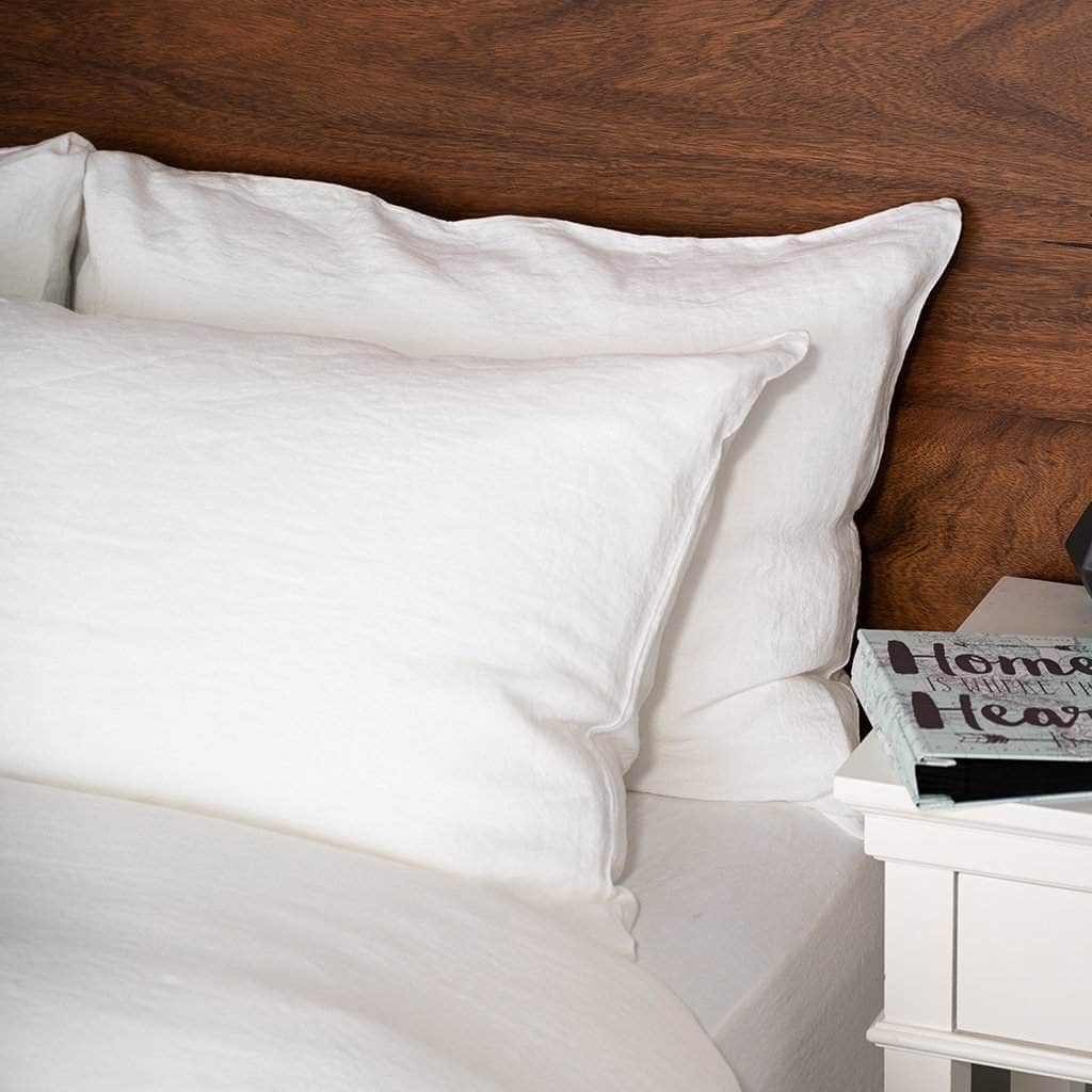 Close up of Linen Pillowcases in White on a bed