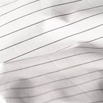 Close up of Essential Collection Percale Sheet Set in Charcoal Stripe