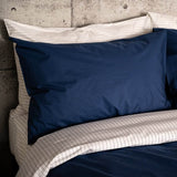 Bed featuring Navy Essential Collection Percale Duvet Cover & Pillowcase Set