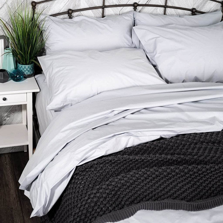 Knit throw blanket on bed