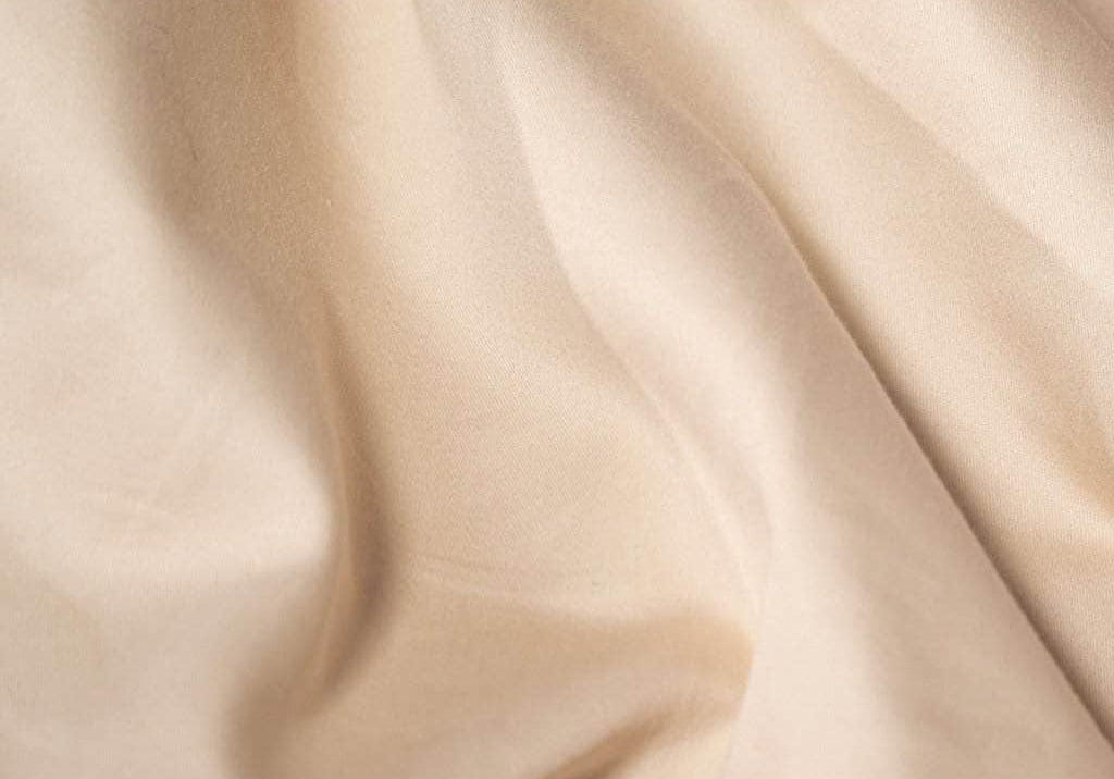 Close up frosted almond sateen sheets