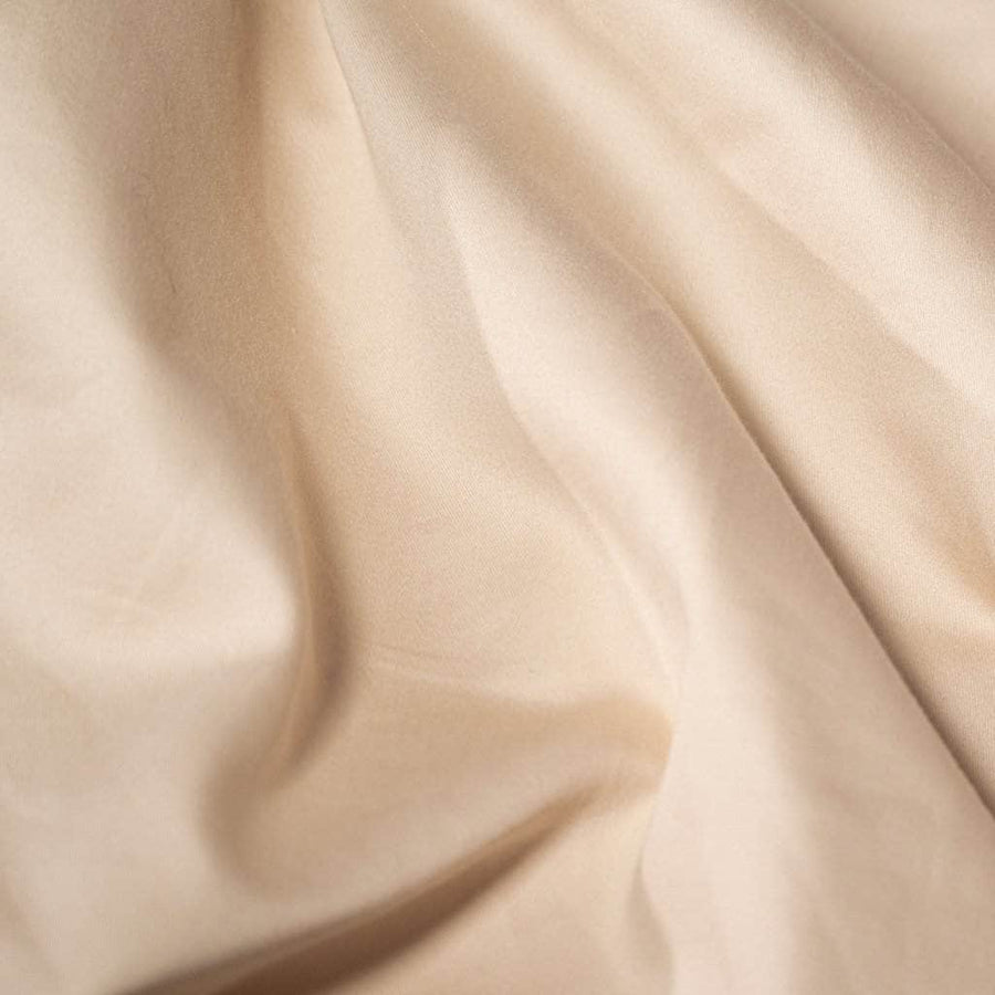 Close up frosted almond sateen sheets
