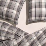 close up of 2 Navy and Chalk plaid pillow cases and duvet cover