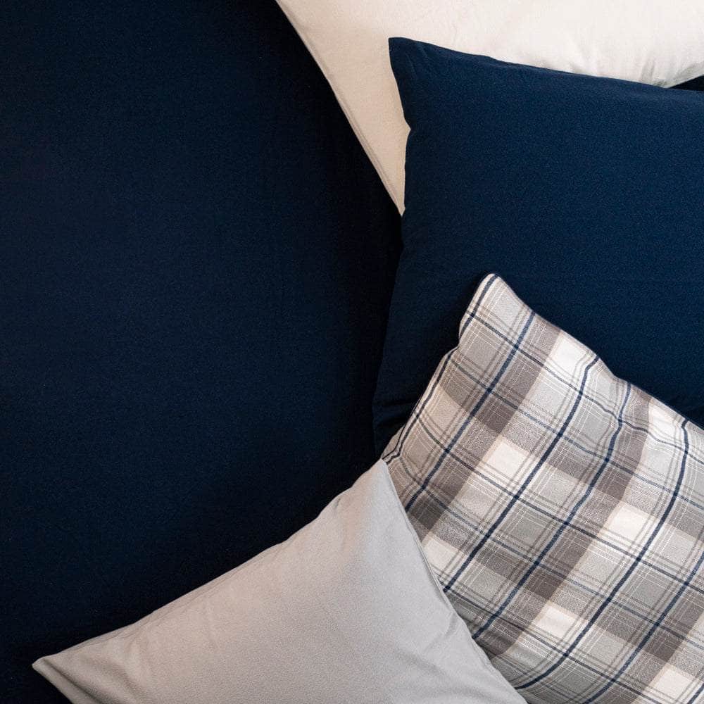 Close up of Navy blue Organic Flannel pillowcases  and Plaid Organic Flannel pillowcases